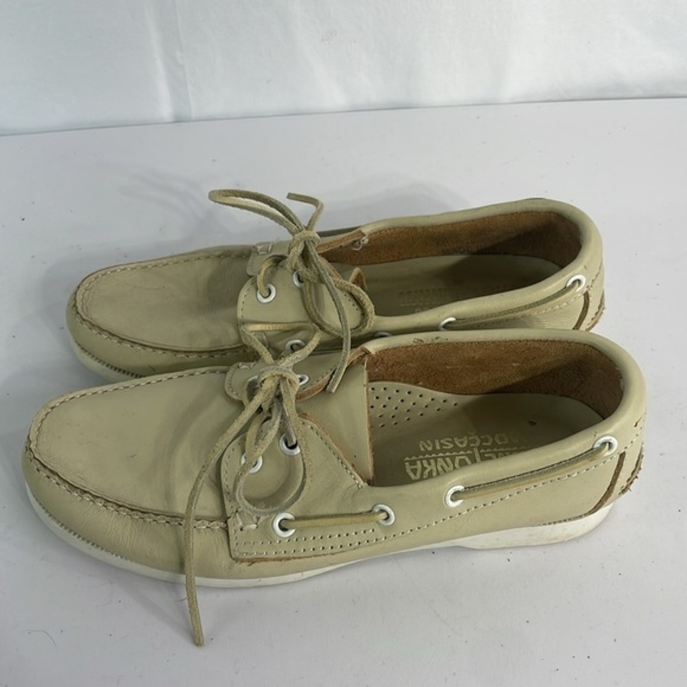 Minnetonka cream leather boat shoes, white sole